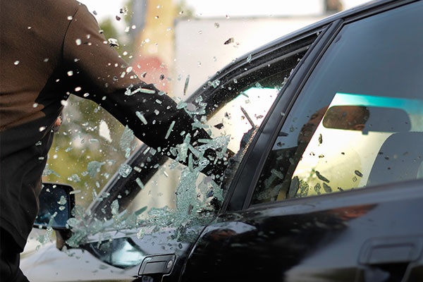 Person breaking into a car