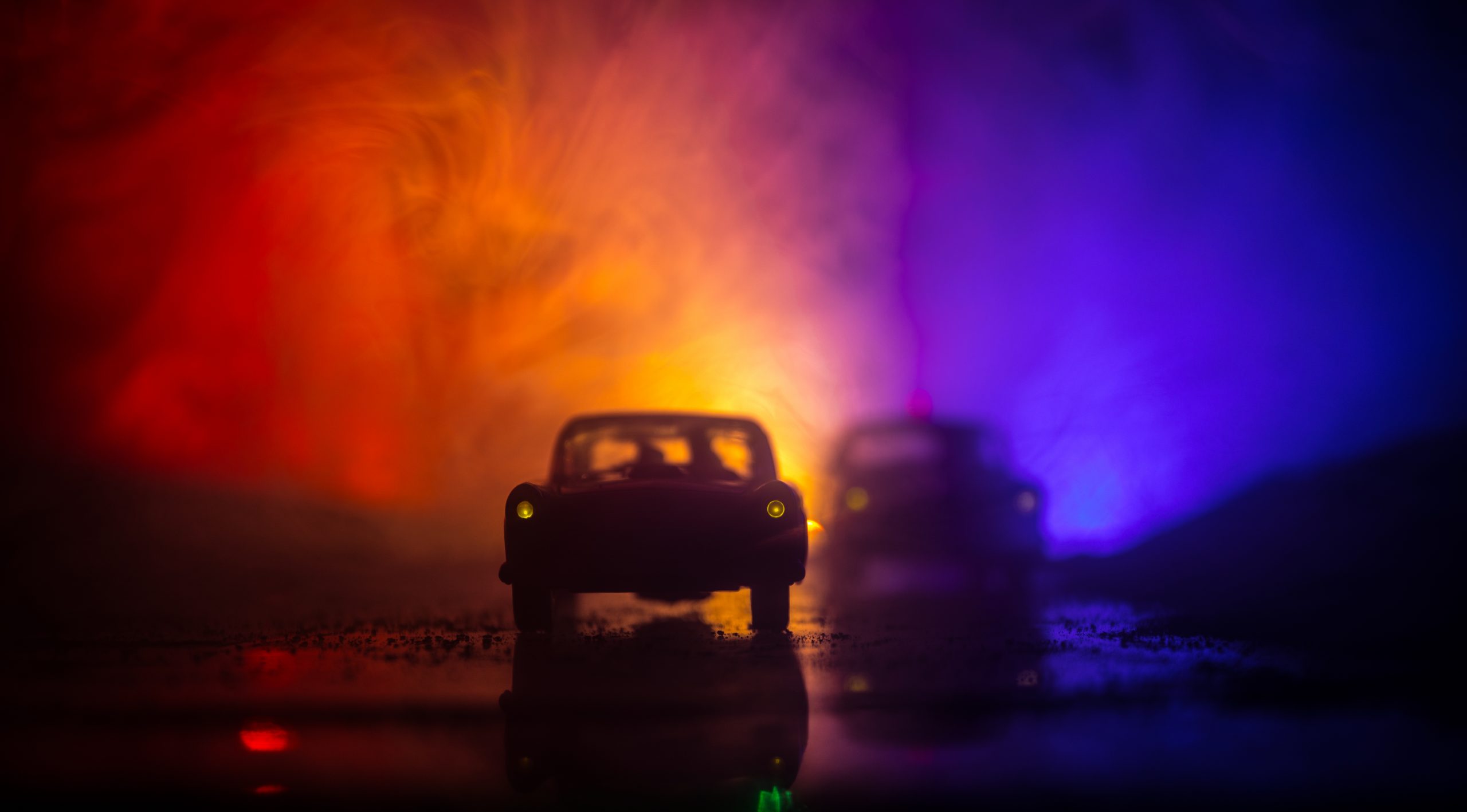 Police,Car,Chasing,A,Car,At,Night,With,Fog,Background.